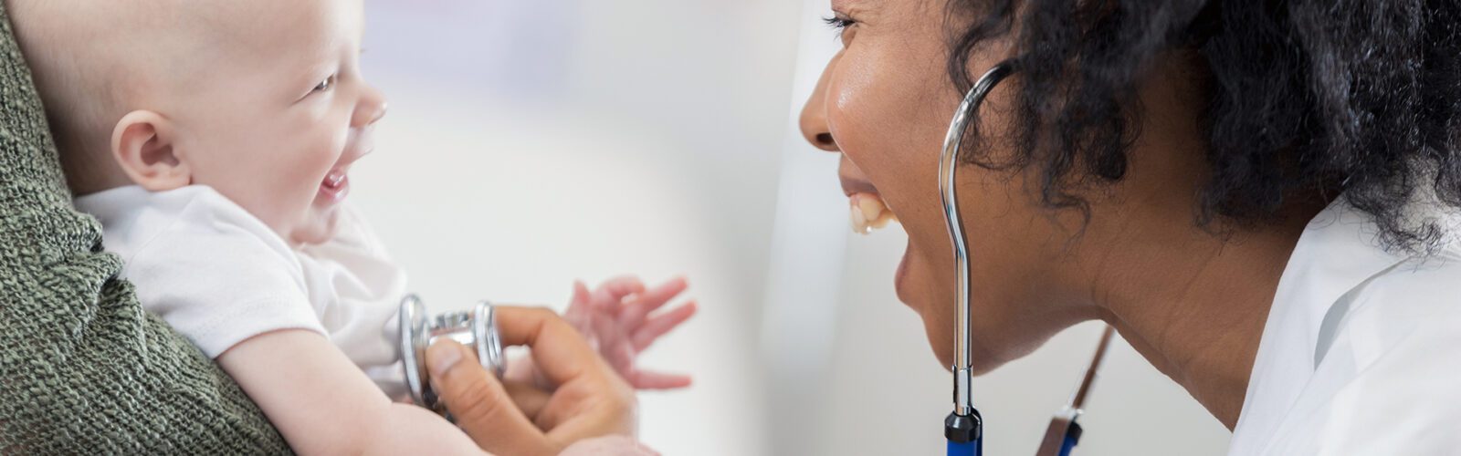 Adorable baby smiles at pediatrician