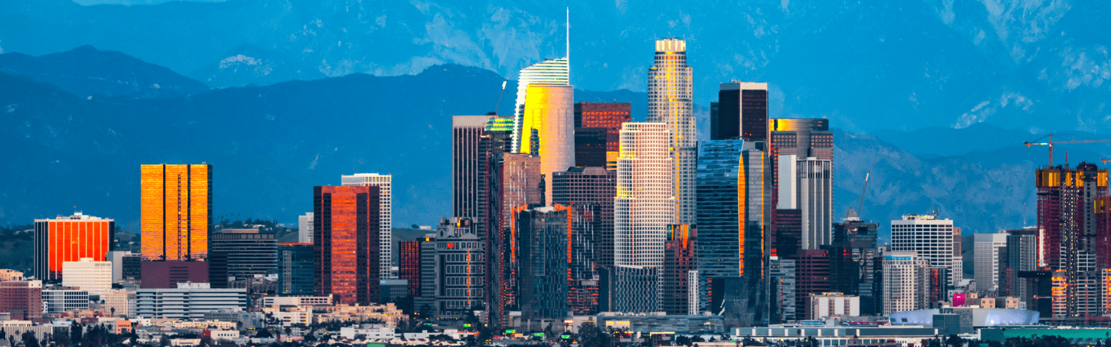 downtown los angeles when the sun sets and reflects across the skyscrapers